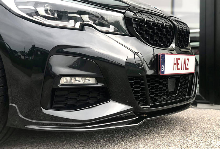 Carbon front splitter on a performance vehicle by Heinz Performance