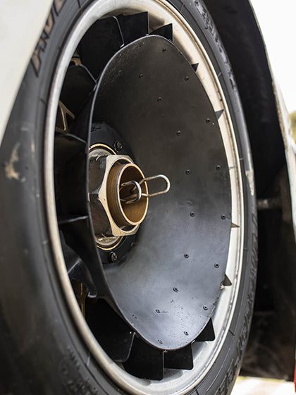 Sports car tire gripping the road, showing traction and handling